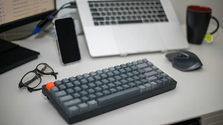 Keyboard with laptop and monitor 