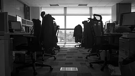 A room with desks and chairs 