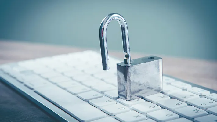 Open padlock on keyboard Open padlock on keyboard