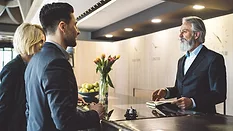 Hotel manager helping businessman