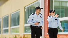 Security officers walking school perimeter
