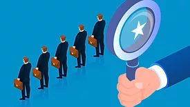 Giant holding magnifying glass to view businessman standing in a row