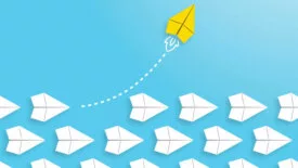 Change concepts with yellow paper airplane leading among white