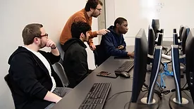 students using computers in university