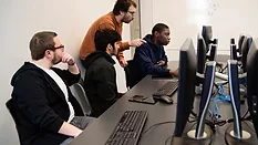 students using computers in university